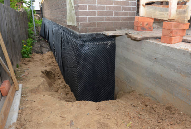 Happy homeowners after waterproofing job in Howard City